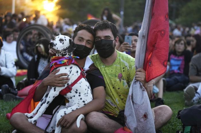 Members of the Movement for Homosexual Integration and Liberation celebrate after lawmakers approved legislation legalizing marriage and adoption by same-sex couples, in Santiago, Chile.