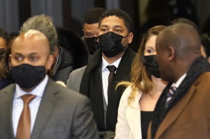 Actor Jussie Smollett, center, returns to the Leighton Criminal Courthouse, Thursday, Dec. 9, 2021, in Chicago.