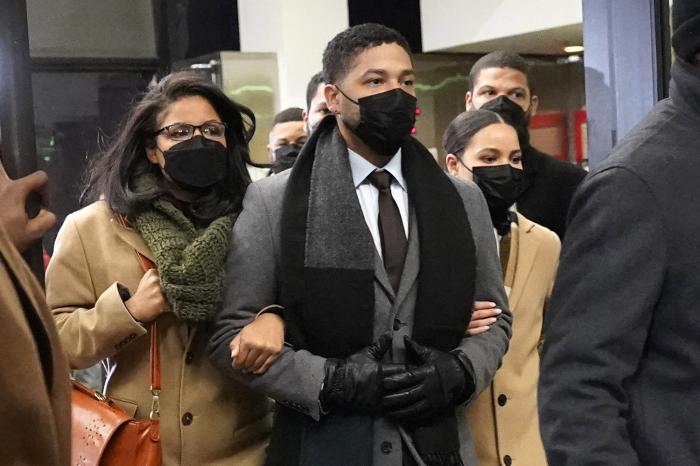 Actor Jussie Smollett, center, leaves the Leighton Criminal Courthouse with unidentified siblings, Thursday, Dec. 9, 2021, in Chicago.