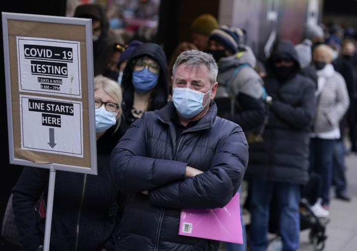 People wait in line at a COVID-19 testing site in New York's Times Square.