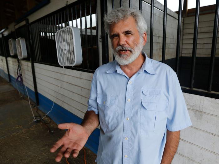 Dr. Robert Malone gestures as he stands in his barn, Wednesday July 22, 2020, in Madison, Va.