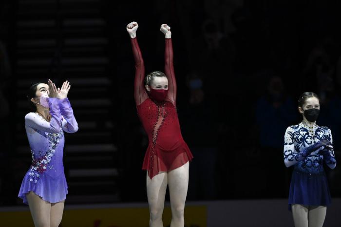 First place, Mariah Bell celebrates with second place, Karen Chen left, and third place, Isabeau Levito during the medal ceremony for the women's free skate program during the U.S. Figure Skating Championships.