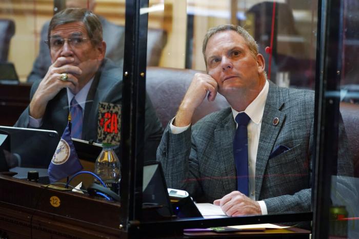 Virginia State Sen. Bill DeSteph, R-Virginia Beach, right, along with Sen. John Cosgrove, R-Chesapeake, left, look at the vote tally board during the Senate session at the Capitol Thursday Jan. 27, 2022, in Richmond, Va.