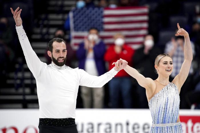 Ashley Cain-Gribble, right, and Timothy LeDuc acknowledge the applause during the pairs short program competition at the U.S. Figure Skating Championships.