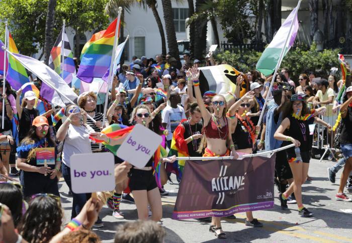 Participants with the Alliance for GLBTQ Youth march at the annual Miami Beach Gay Pride Parade, Sunday, April 9, 2017, in Miami Beach, Fla.