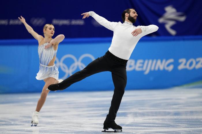 Ashley Cain-Gribble and Timothy Leduc, of the United States, compete in the pairs short program during the figure skating competition at the 2022 Winter Olympics.