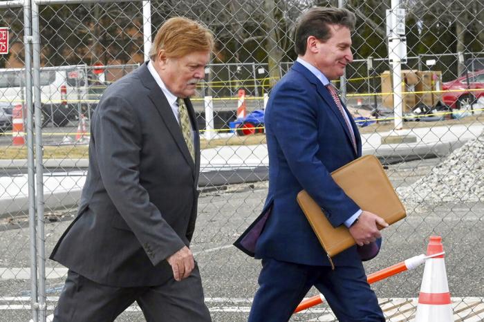 Robert Fehring, left, arrives at federal court with his attorney, in Central Islip, NY.