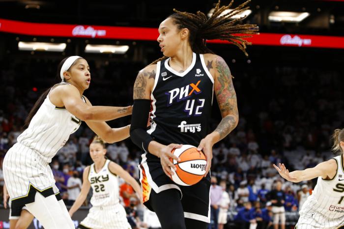 Phoenix Mercury center Brittney Griner (42) looks to pass as Chicago Sky center Candace Parker defends during the first half of game 1 of the WNBA basketball Finals.