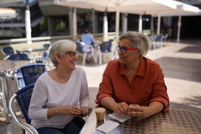 Elena Hernáiz, left, and Ana Margarita Rojas, smile during an interview in Caracas, Venezuela.