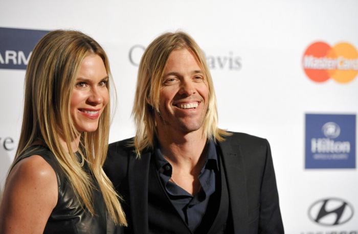  Foo Fighters drummer Taylor Hawkins, right, and Alison Hawkins arrive at the Clive Davis Pre-GRAMMY Gala in 2013.