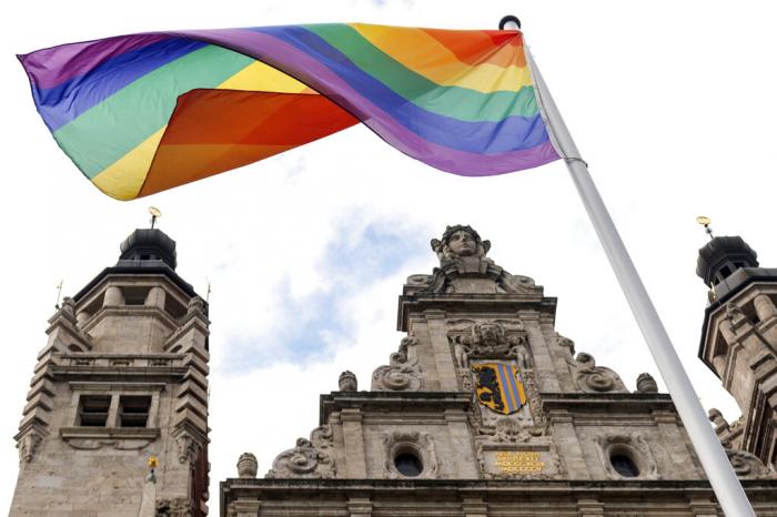 A rainbow flag flies over the New City Hall, in Leipzig, Germany.