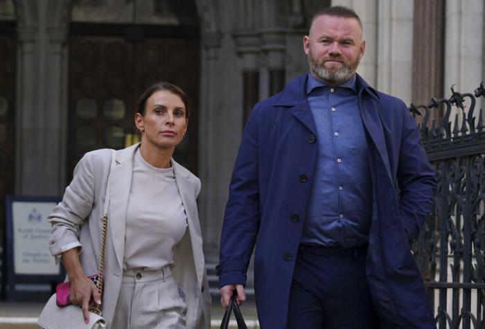 Coleen and Wayne Rooney leave the Royal Courts Of Justice in London.