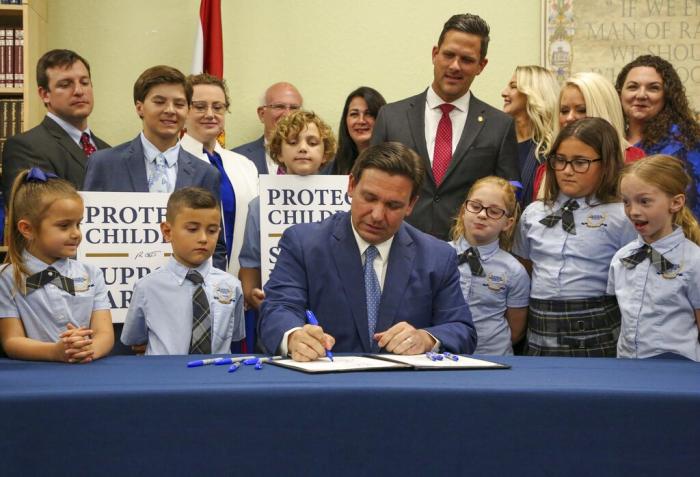 Florida Gov. Ron DeSantis signs the Parental Rights in Education bill at Classical Preparatory school, March 28, 2022 in Shady Hills, Fla.