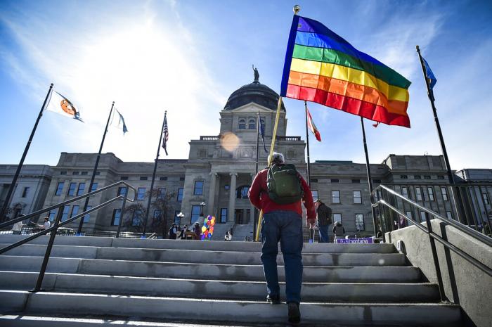 Demonstrators gather on the steps of the Montana State Capitol protesting anti-LGBTQ+ legislation in Helena, Mont. 