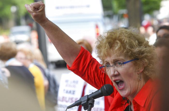 Christa Brown, of Denver, Colo., speaks during a rally in Birmingham, Ala., outside the Southern Baptist Convention's annual meeting.