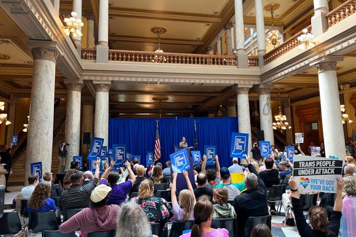 Kit Malone, an advocacy strategist with the American Civil Liberties Union of Indiana, leads a rally at the Statehouse in Indianapolis.
