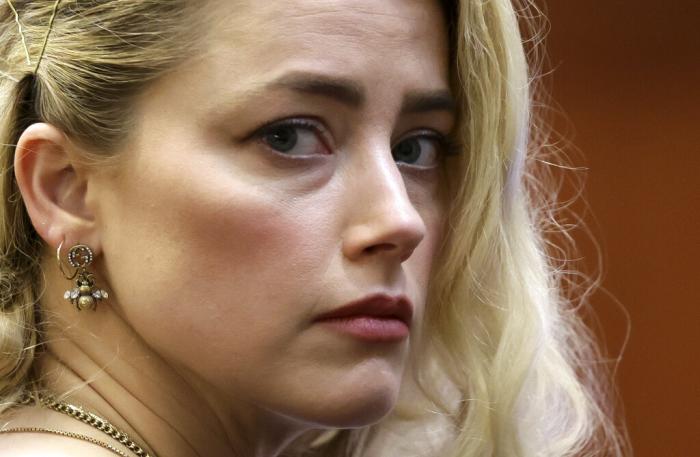 Actor Amber Heard waits before the verdict was read at the Fairfax County Circuit Courthouse in Fairfax, Va.
