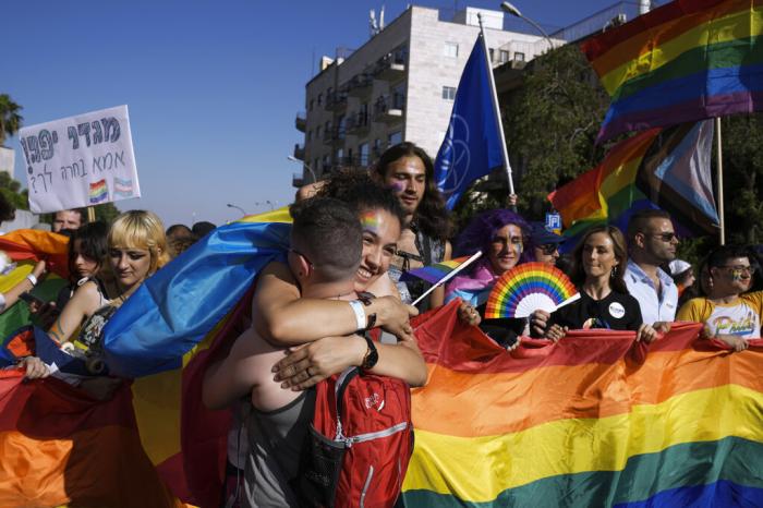 Thousands of people march under heavy security in the annual Pride Parade, in Jerusalem.