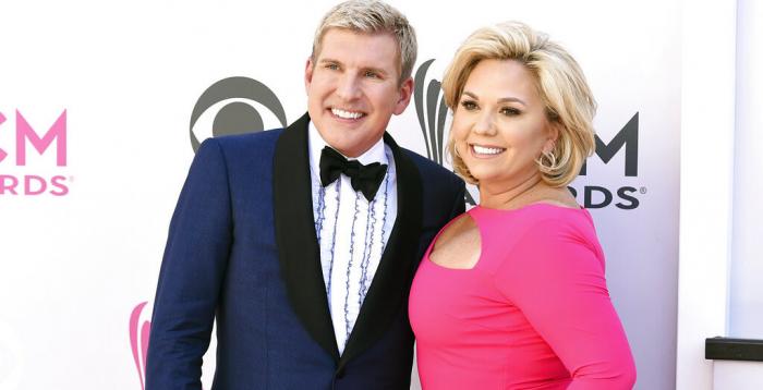 Todd Chrisley, left, and his wife, Julie Chrisley, pose for photos at the 52nd annual Academy of Country Music Awards on April 2, 2017, in Las Vegas. 