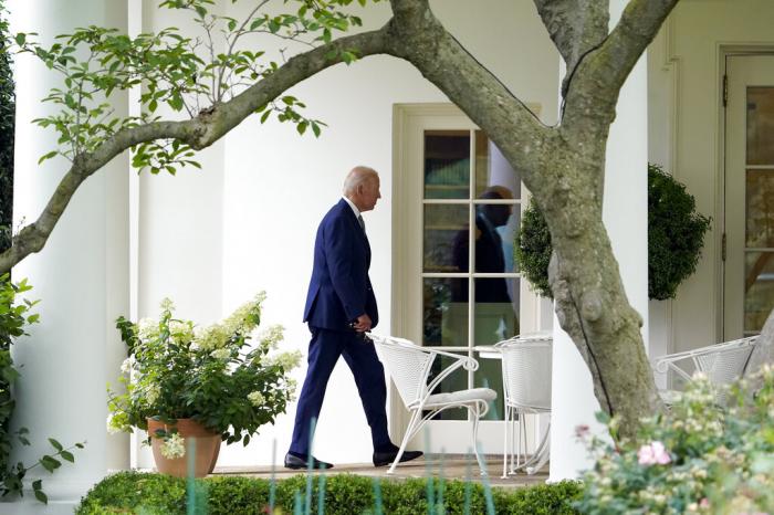 President Joe Biden walks to the Oval Office of the White House after arriving on Marine One.