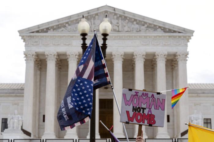 Abortion-rights activists protest outside of the U.S. Supreme Court on Capitol Hill in Washington.