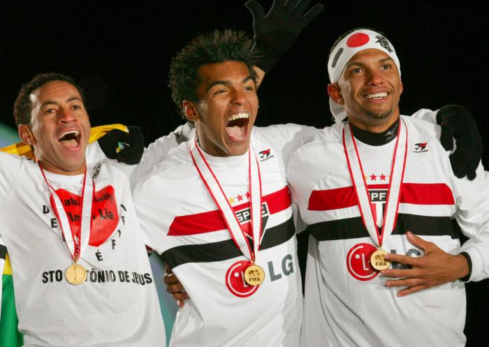 Brazil's Sao Paulo midfielder Richarlyson, center, celebrate with teammates their gold medals after winning the FIFA Club World Championship Toyota Cup title in Yokohama, near Tokyo in 2005.