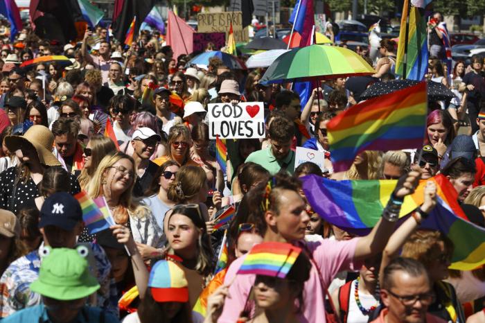 People take part in the 'Warsaw and Kyiv Pride' marching for freedom in Warsaw, Poland.