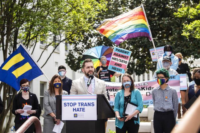 Alabama Rep. Neil Rafferty speaks in support of transgender rights during a rally outside the Alabama State House in Montgomery, Ala.