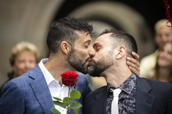 Luca Morreale and Stefano Perfetti kiss after converting their registered partnership into marriage, at the registry office in Zurich.
