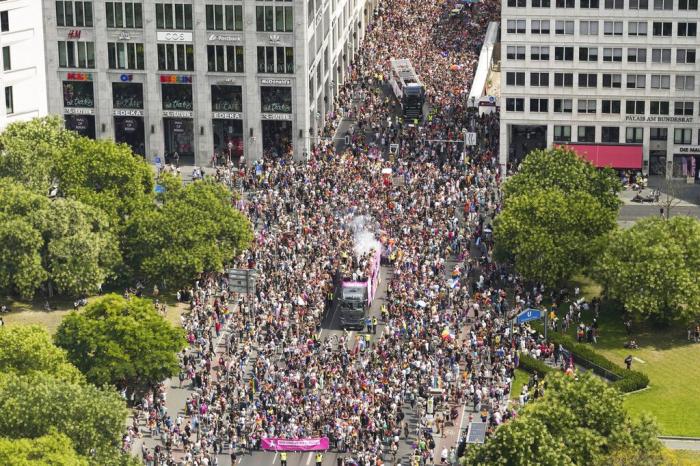Revelers march down the Leipziger Strasse street on the Leipziger Platz square during the annual pride march in the German capital Berlin.