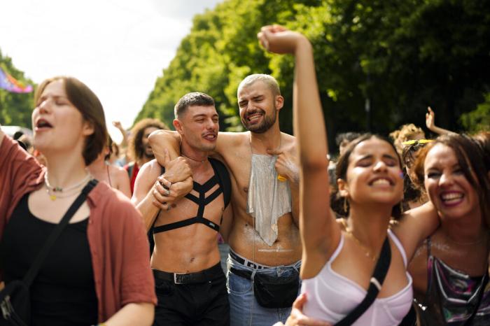 Revelers dance as they take part in the annual pride march in Berlin, Germany.