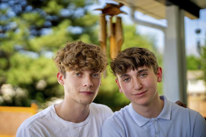 Jacob Metcalf and Christian Peacock pose for a photo in Sandy, Utah.