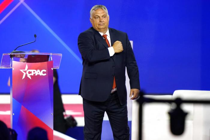 Hungarian Prime Minister Viktor Orban gestures with his fist on his chest after speaking at the Conservative Political Action Conference (CPAC) in Dallas.