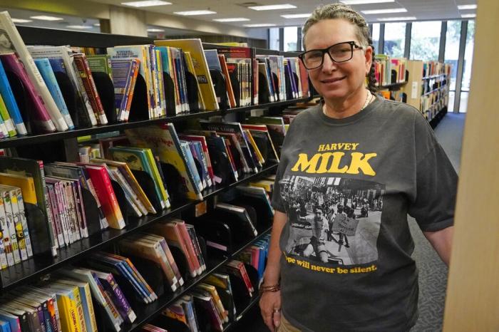 Gretchen Robinson, a lesbian high school teacher in Orange County, Fla., poses for a photo at the downtown library.
