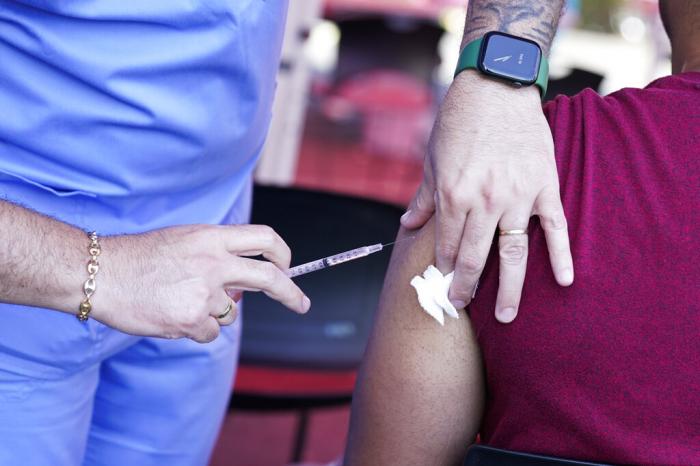 A nurse administers a monkeypox vaccine at a walk-in clinic at the North Jersey Community Research Initiative in Newark, N.J.