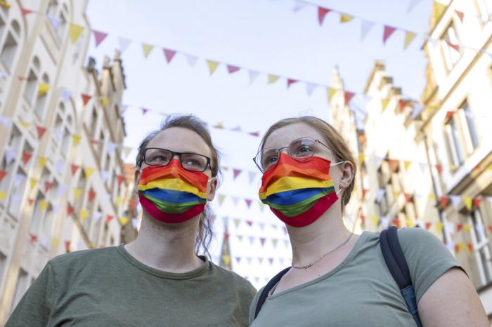 People demonstrate on Prinzipalmarkt against violence against LGBT people, in Muenster, Germany.