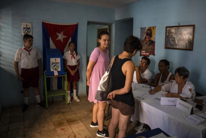 Two women register to vote at a polling station during the new Family Code referendum in Havana, Cuba, Sunday, Sept. 25, 2022.