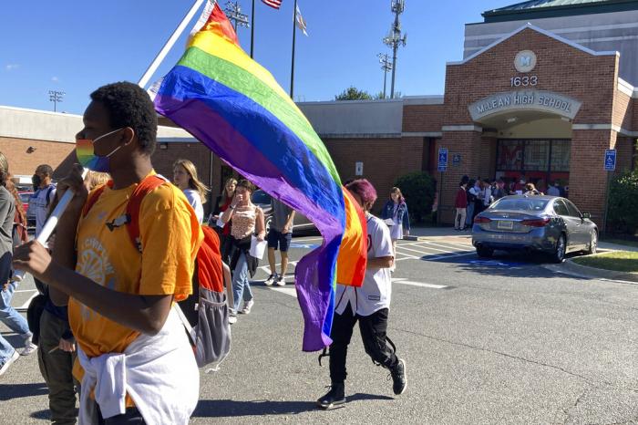 Students at McLean High School in McLean, Va., walk out of classes Tuesday, Sept. 27, 2022. 