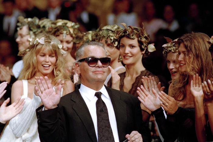 German fashion designer Karl Lagerfeld acknowledges the applause of his models at the end of the show he designed for the French fashion house Chanel, for the 1993-94 Fall-Winter haute couture collection in Paris.