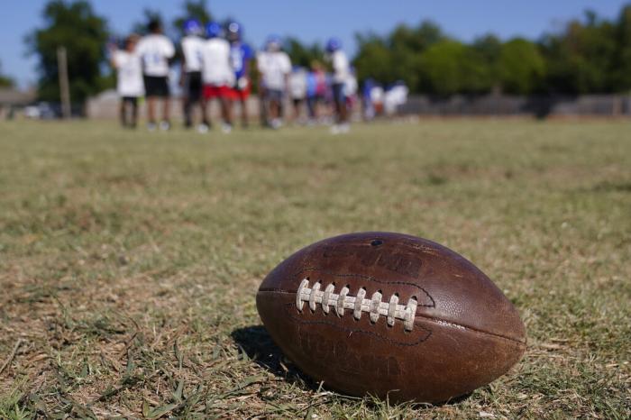 A middle school football team practices Wednesday, Sept. 28, 2022, in Oklahoma City.