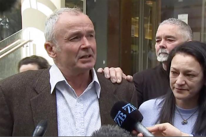 Mark Ellis, left, brother of Peter Ellis, speaks to the media outside a court in Wellington Friday, Oct. 7, 2022. 