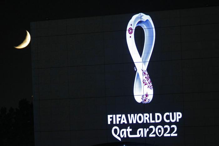 The 2022 Qatar World Cup logo is projected on the opera house of Algiers, Tuesday Sept. 3, 2019