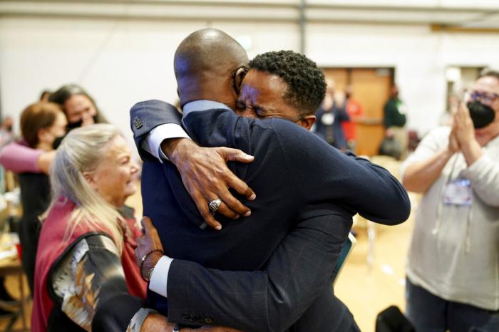 Bishop Cedrick Bridgeforth, a United Methodist elder in the California-Pacific Conference, embraces his husband, Christopher Hucks-Ortiz, after his election was announced on Nov. 4, 2022, at Christ United Methodist Church in Salt Lake City.