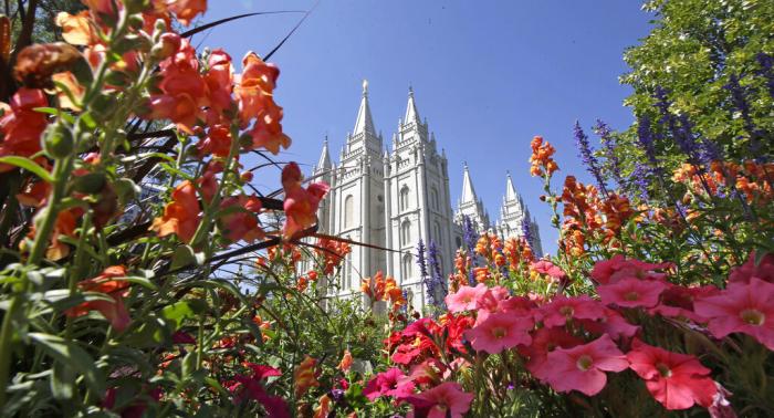 Flowers bloom in front of the Salt Lake Temple, at Temple Square, on Aug. 4, 2015, in Salt Lake City.