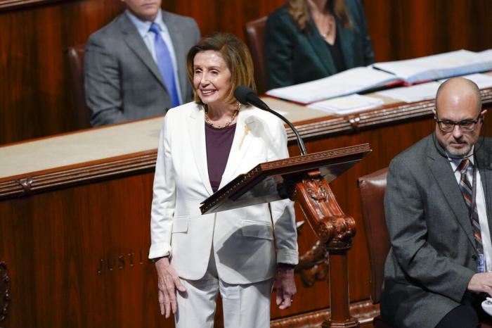 House Speaker Nancy Pelosi of Calif., acknowledges applauds from lawmakers after speaking on the House floor at the Capitol in Washington.