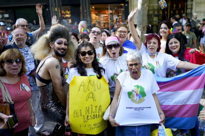 Members of the Latin American Movement of Mothers of LGTB+ Children pose for a group photo during a march in Buenos Aires Argentina, Saturday, Nov. 5, 2022.