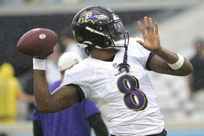 Baltimore Ravens quarterback Lamar Jackson (8) warms up before an NFL football game against the Jacksonville Jaguars, Sunday, Nov. 27, 2022, in Jacksonville, Fla.