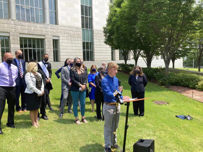 Dylan Brandt speaks at a news conference outside the federal courthouse in Little Rock, Ark., July 21, 2021.