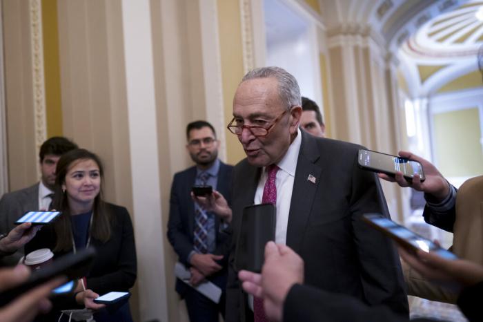 Senate Majority Leader Chuck Schumer, D-N.Y., speaks with reporters before Senate Democrats move forward on legislation to protect same-sex and interracial marriage, at the Capitol in Washington, Wednesday, Nov. 16, 2022.