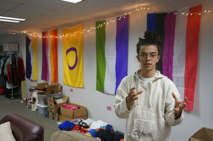 Sean Fisher, one of the student coordinators for QPLUS, the LGBTQ student organization for the College of Saint Benedict and Saint John's University, stands in the organization's dedicated lounge on the college's campus in St. Joseph, Minn.